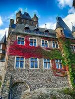 Fall colors on Reichsburg Castle  at Cochem, Germany photo