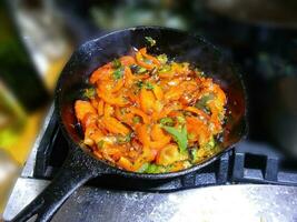 Saute of red bell pepers and jalapenos photo