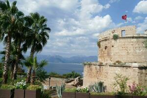 Ancient defensive tower on cliff photo