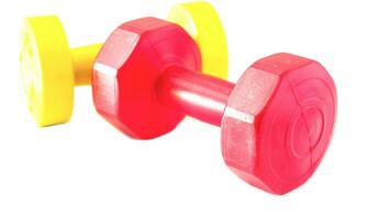 Isolated Dumbbell Concept. Fitness Equipment for Gym Workout, Strength Training, Bodybuilding, and Powerlifting photo