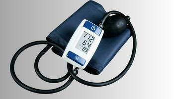 Isolated Blood Pressure Meter on White Background, Healthcare Monitoring Equipment photo