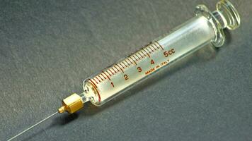 Vintage Glass Syringe, Nostalgic Medical Relic isolated photo