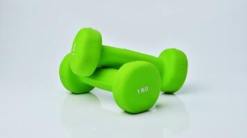 Isolated Dumbbell Concept. Fitness Equipment for Gym Workout, Strength Training, Bodybuilding, and Powerlifting photo