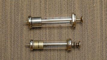 Vintage Glass Syringe, Nostalgic Medical Relic isolated photo