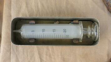 Vintage Glass Syringe, Nostalgic Medical Relic isolated photo