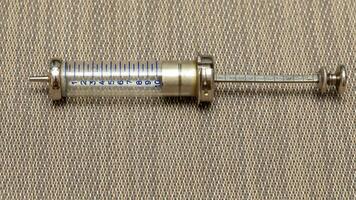 Vintage Glass Syringe, Nostalgic Medical Relic isolated photo