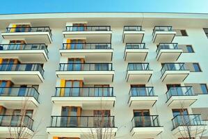 Modern and new apartment building. Multistoried, modern, new and stylish living block of flats. photo