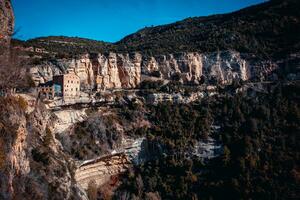 Sant Miquel del Fai is ancient monastery photo. Benedictine monastery set in cliffs, Catalonia. photo