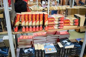 New Delhi, India, September 09 2023 - Variety of Books on shelf inside a book-stall at Delhi International Book Fair, Selection of books on display in Annual Book Fair. photo