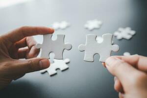 Hand put the last piece of jigsaw puzzle to complete the mission, Business solutions, success and strategy concept, The solution includes completing the mission. photo