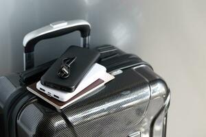 Power bank and passport on luggage for travel of holiday photo