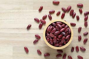 Top view of red kidney beans in a bowl on wooder background, Healthy eating concept photo