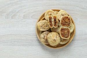 Dried figs turkey in a bowl on wooder background photo