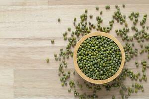 Top view of green beans in a bowl on wooder background, Healthy eating concept photo