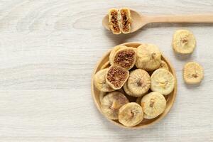 Dried figs turkey in a bowl on wooder background photo