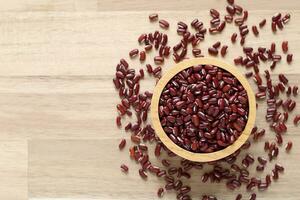 Top view of red beans in a bowl on wooder background, Healthy eating concept photo