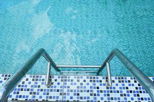 iron banister to climb up from the swimming pool. photo