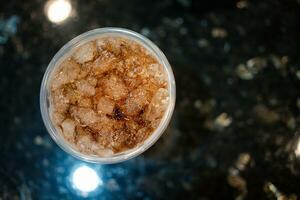 Cups of soft drinks with ice photo