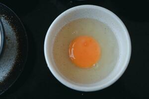 Raw fresh egg for cooking or making shabu shabu and sukiyaki photo