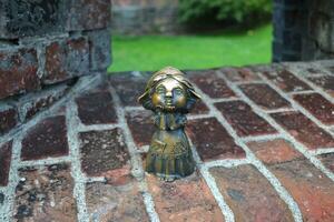 Kaliningrad, Russia, bronze statuette of homlin mama Varya, local landmark, city brownie photo