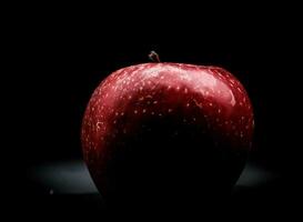 bright, vividly colored red apple on a black background during a studio photo session in the winter of 2023