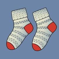 Knitted Socks. Winter clothes. Beautiful cozy clothes with patterns and ornaments. vector