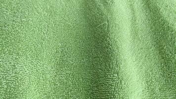 Close up of green towel texture background. photo