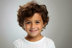 AI generated Portrait of a smiling boy on a plain gray background. photo