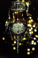 Clock showing time in a glass of champagne for a festive or motivating background photo