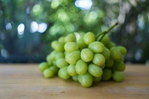 Bunch of ripe and juicy green grapes photo