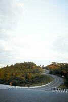 Beautiful curved road look like number 3 on the high mountain along the way to Bo Kluea district in Nan province, Thailand. photo