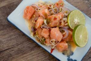 Thai style spicy salad salmon. Healthy and spicy menu. photo