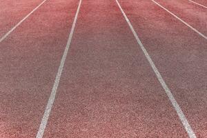 Sports surface, stadium running track. Background for motivation, striving forward. Copyspace photo
