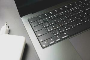 Bangkok, Thailand - December 27, 2023 Close up of a Thai language keyboard of Apple MacBook Pro M3 Max photo