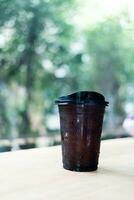 Iced black coffee or Americano coffee in takeaway glass photo