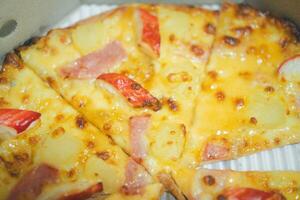 Pizza with ham and crab sticks photo