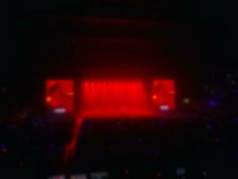 Blur background of big concert stage, red light photo