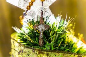 Religious Christian theme with Biblical concept of Jesus Christ crucified on the cross for the holiday of Forgiveness Sunday or Christmas photo