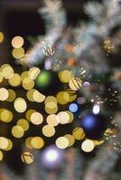 Blurred Christmas and New Year theme background with glowing and sparkling elements photo