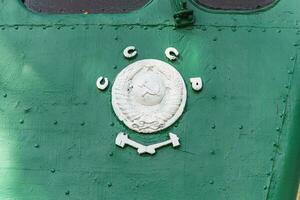 Text and numbers on a metal surface with the symbols of the USSR for design and commercial use photo