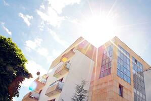 Modern and new apartment building. Multistoried, modern, new and stylish living block of flats. photo