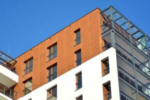 Modern and new apartment building. Multistoried, modern, new and stylish living block of flats. photo