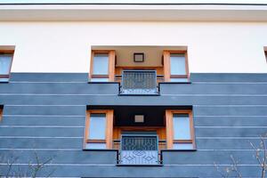 Modern and new apartment building. Multistoried, modern, new and stylish living block of flats. photo