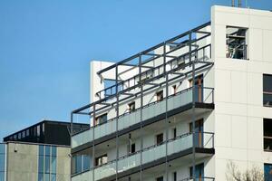 Modern and new apartment building. Multistoried, modern, new and stylish living block of flats. photo