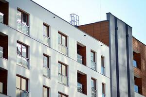 Modern and new apartment building. Multistoried, modern, new and stylish living block of flats. photo