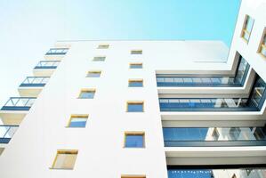 Modern and new apartment building. Multistoried, modern, new and stylish living block of flats. photo