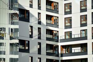 Modern and new apartment building. Multistoried, modern, new and stylish living block of flats. photo