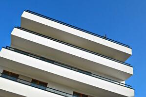 Modern and new apartment building. Multistoried, modern, new and stylish living block of flats. photo