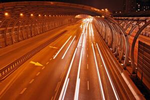 Cars on street. City street lights at night. photo