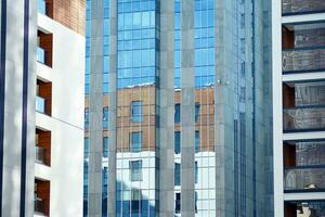 Modern and new apartment building. Multistoried, modern, new and stylish living block of flats. photo